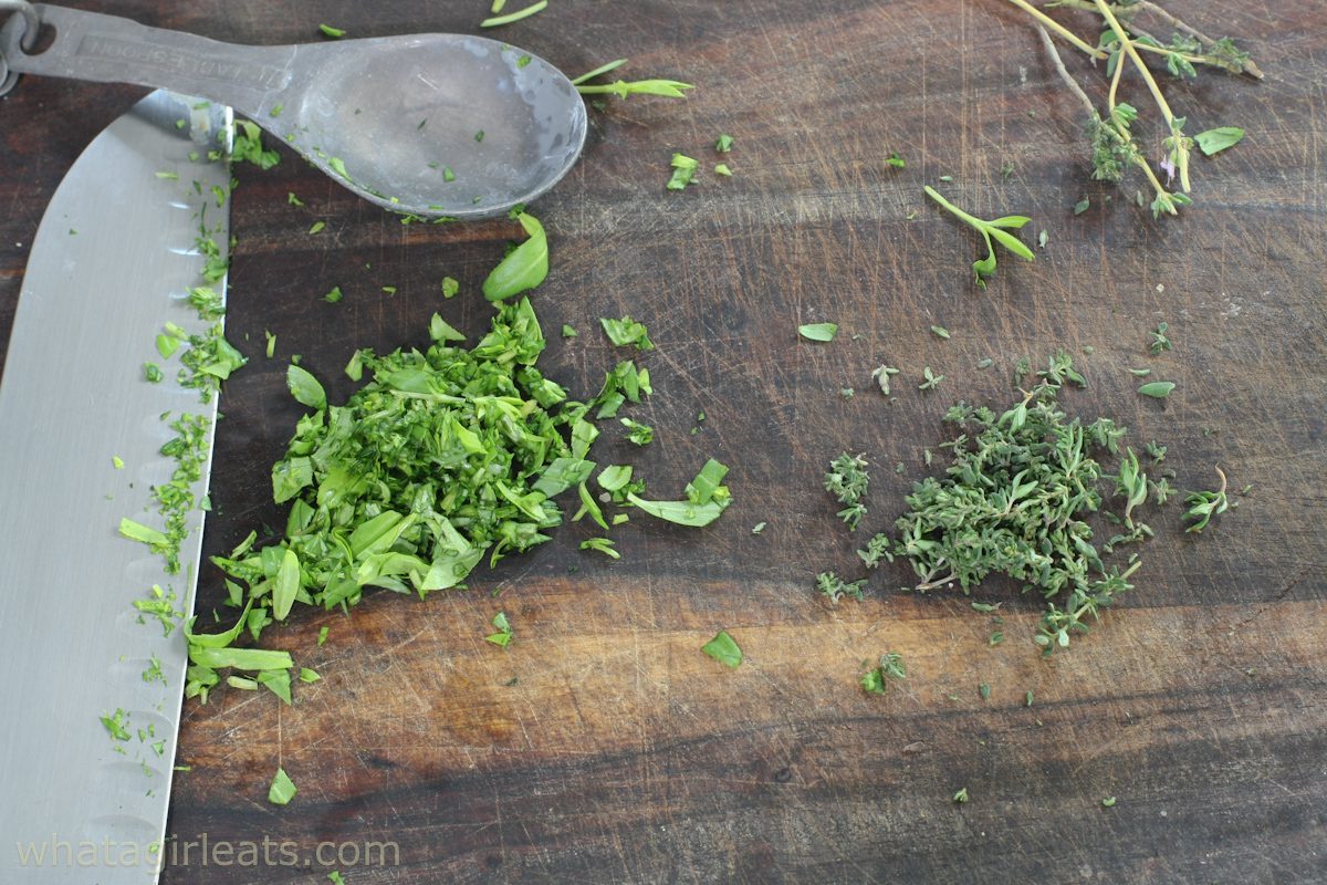 fine herbes on cutting board.