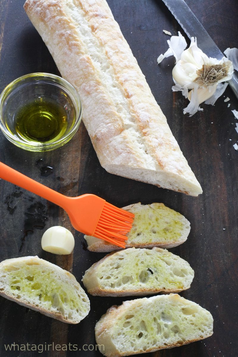 brush the baguette with olive oil.