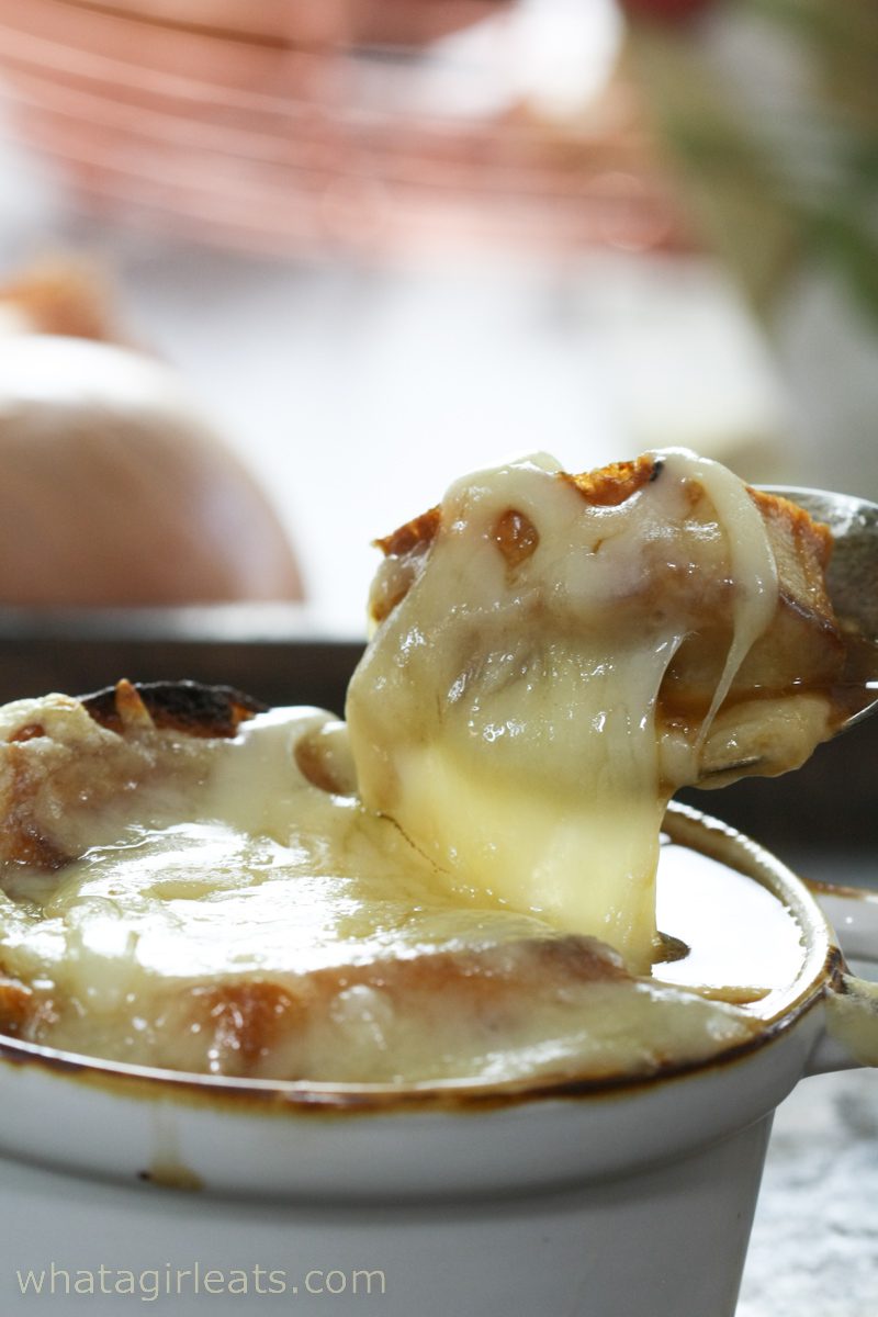 Gooey cheese on French onion soup.