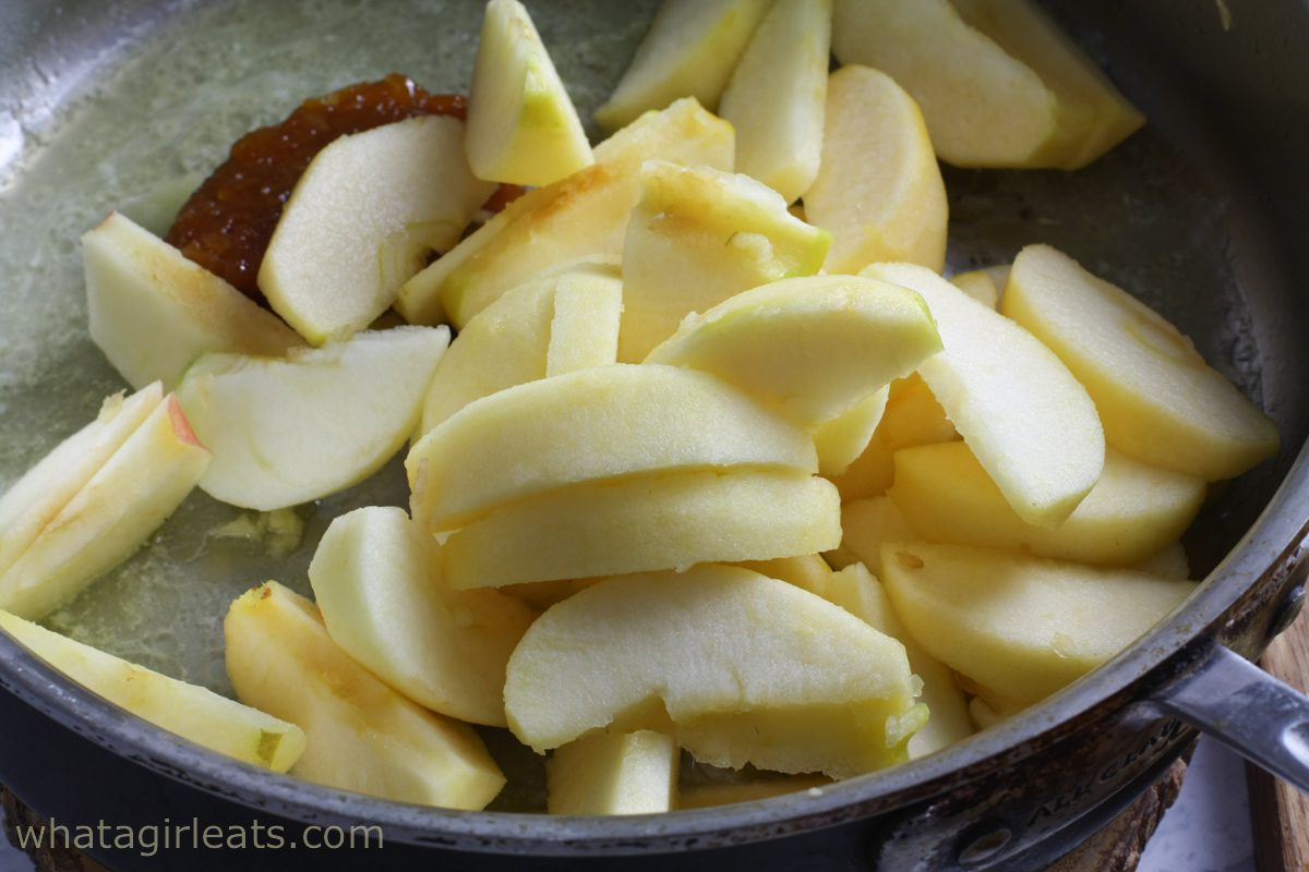 Cooking apples in sauce pan.