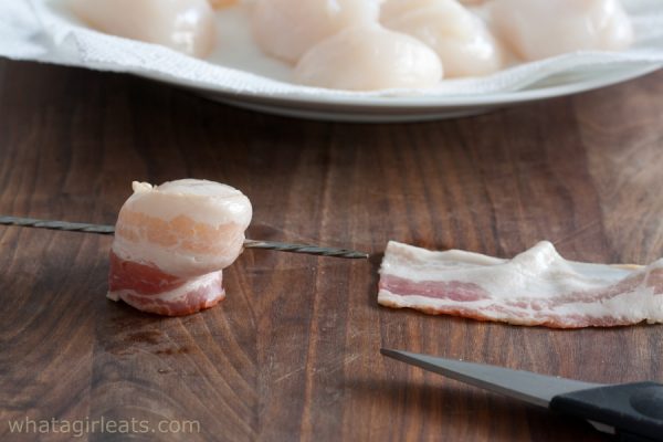 wrapping the scallops in bacon.