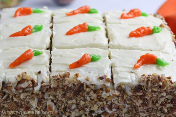 Horizontal carrot cake with cream cheese frosting.