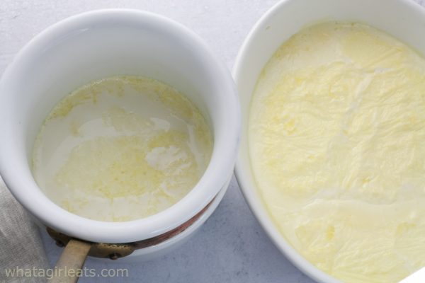 two methods of making clotted cream. double boiler and baking dish with cream.