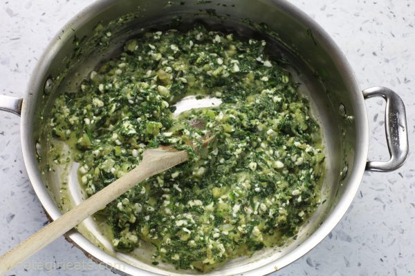 spinach and feta in a saute pan.