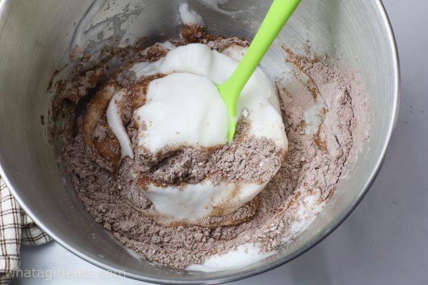 mixing whites with chocolate.