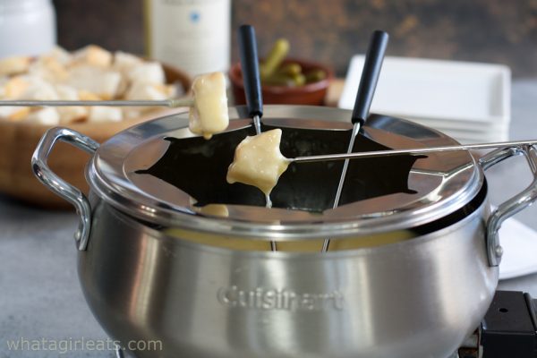 Cheese fondue in pot.