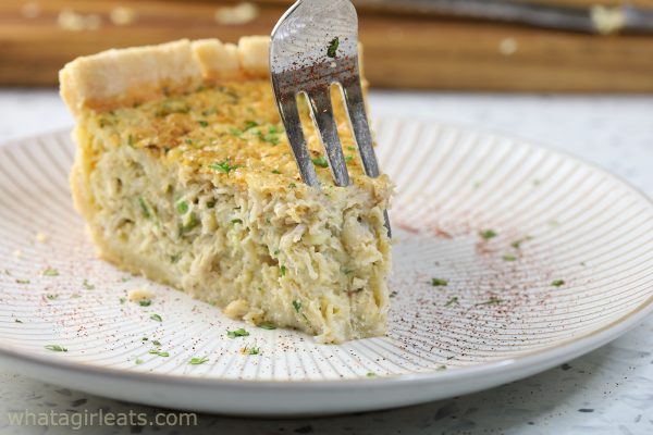 Crab quiche with fork in it.