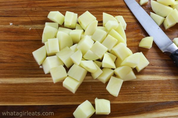 diced potatoes on cutting board.