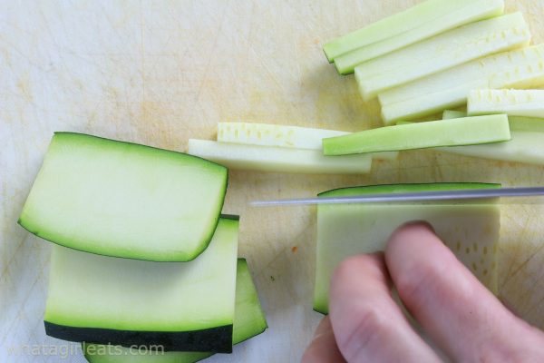cutting zucchini.
