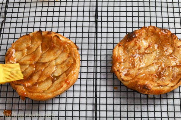 brushing apple tarts with apricot glaze.