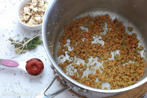 adding tomato paste.