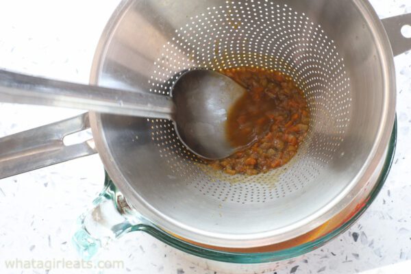 pressing vegetables in sauce.
