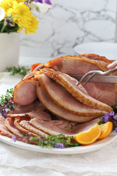 bourbon glazed ham vertical shot on platter.