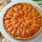 apricot tart top shot on white plate.