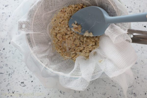 pressing hazelnuts.