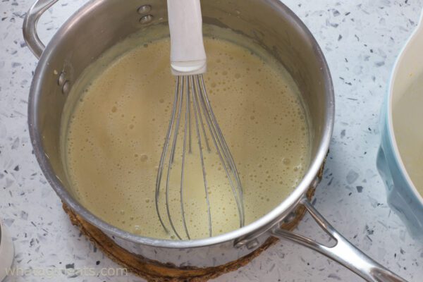 tempering egg yolks and cream.