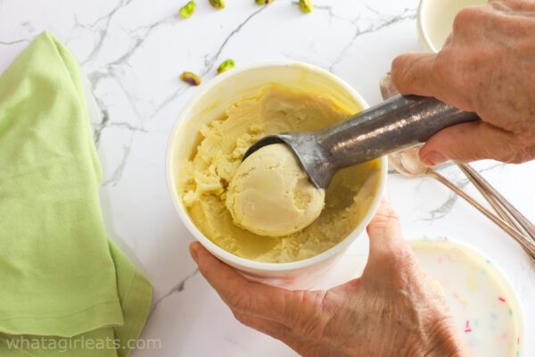 pistachio gelato in freezer container.