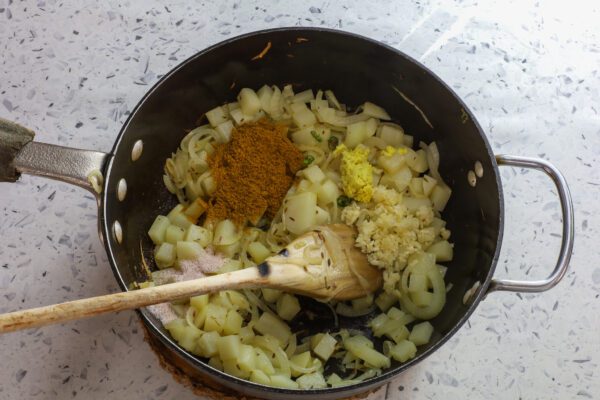 adding spices to ground beef.