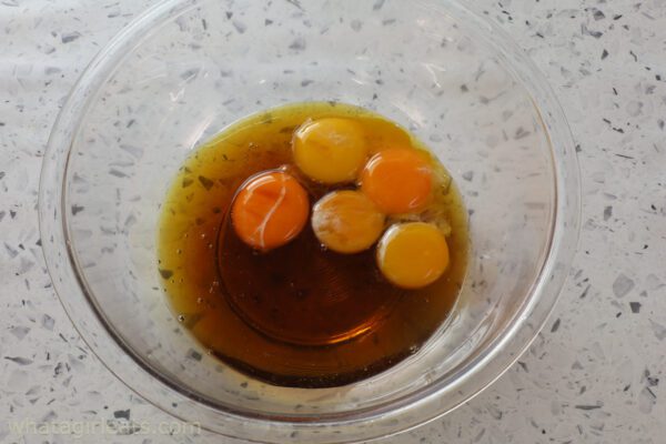 whisking egg yolks and maple syrup.