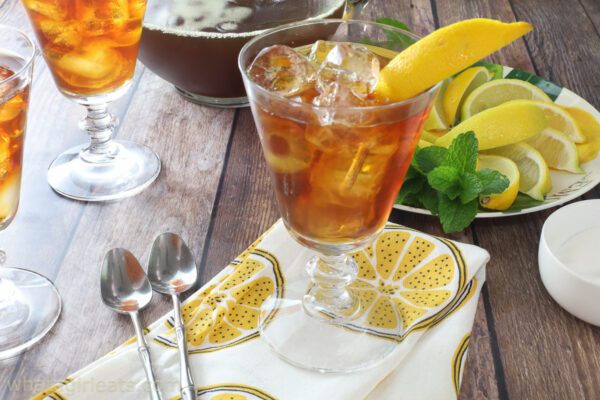 perfect cup of iced tea in glass with lemons.