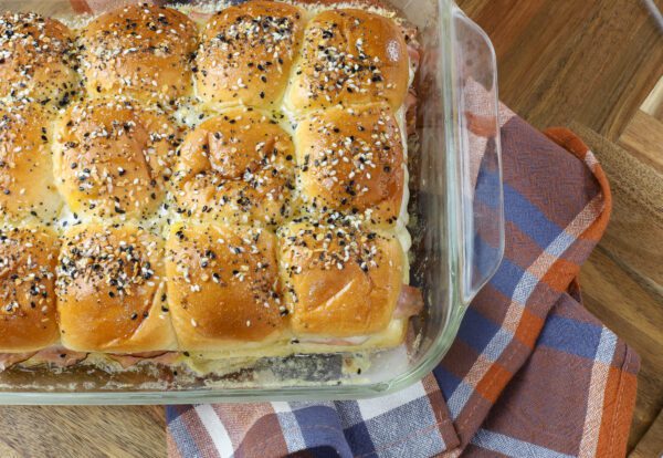 top shot of ham and cheese sliders in pan.