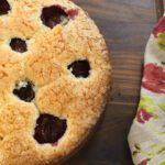 half plum cake on board.
