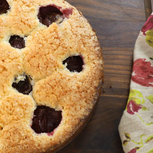 half plum cake on board.