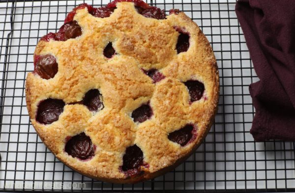 plum cake on wire rack.