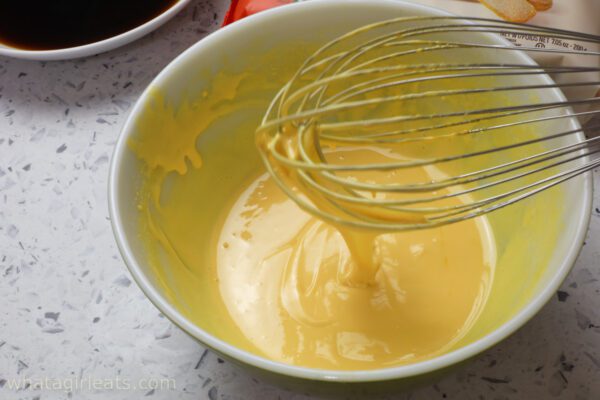 thick ribbons of yolk and sugar Ribbons of egg yolk and sugar.