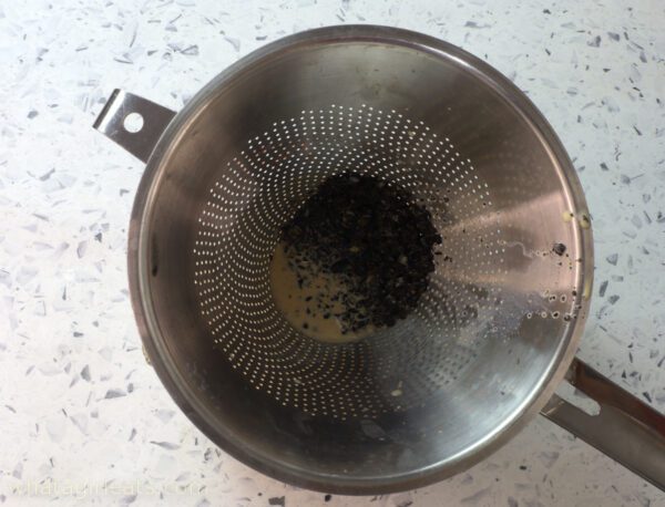 straining coffee beans.