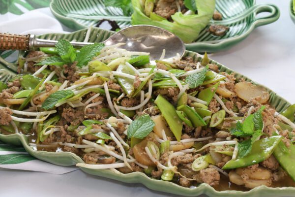 asian lettuce wrap mixture in green dish.