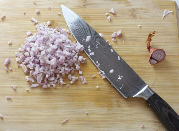 chopped shallots chopped shallots on cutting board.