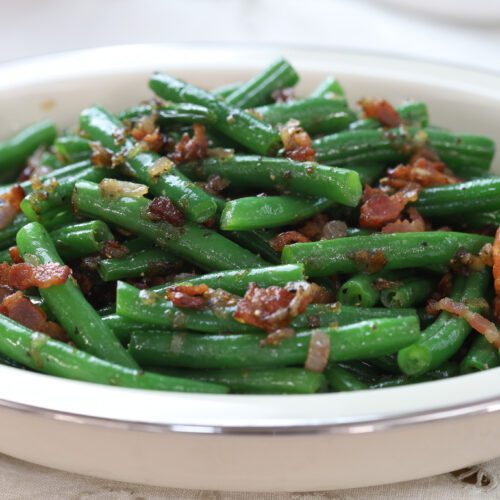 Green beans with bacon closeup.