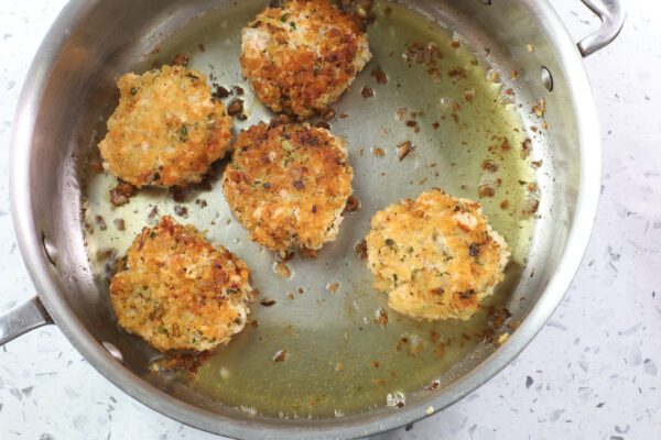 cakes in frying pan.