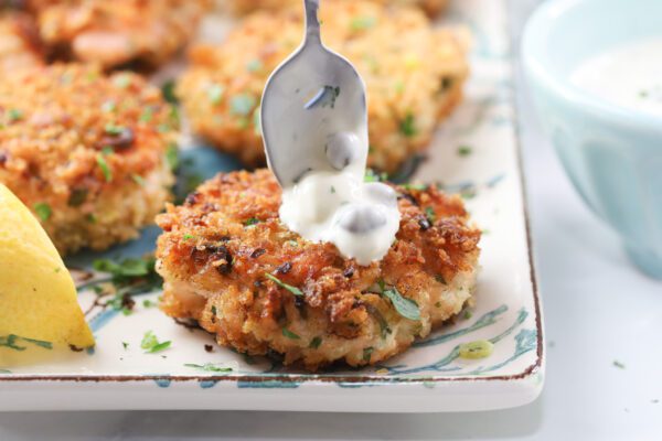 salmon cakes with spoon Salmon cakes with fresh salmon.