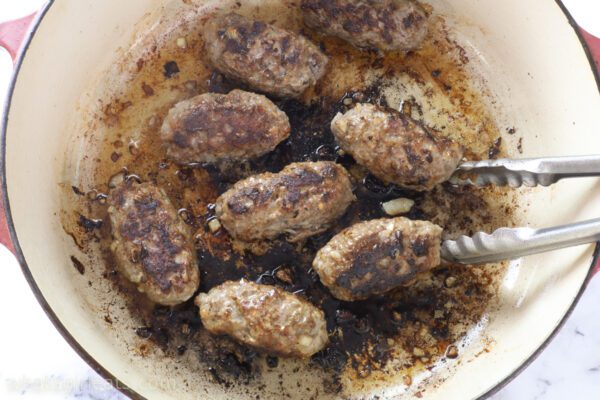 frying lamb kebabs.